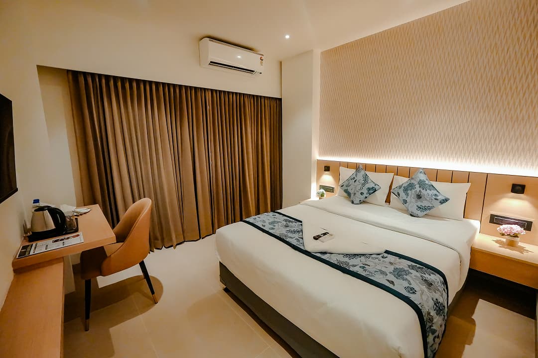 Bedroom deskview of Premium double room at BKS Grand Hotel, Kodigehalli, Bengaluru