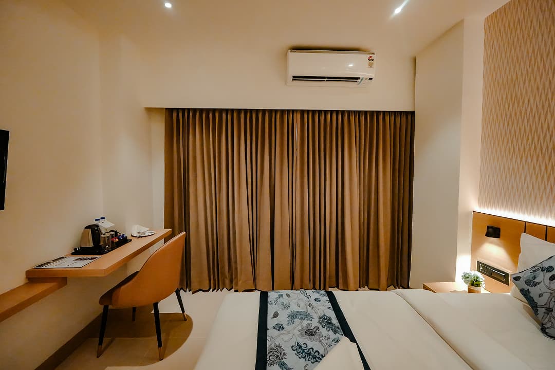 Bedroom frontview of Premium double room at BKS Grand Hotel, Kodigehalli, Bengaluru