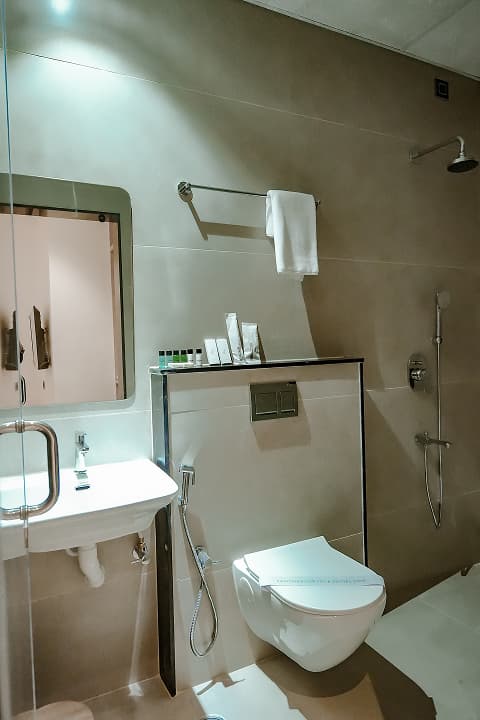 Bathroom in Premium triple room at BKS Grand Hotel, Kodigehalli, Bengaluru