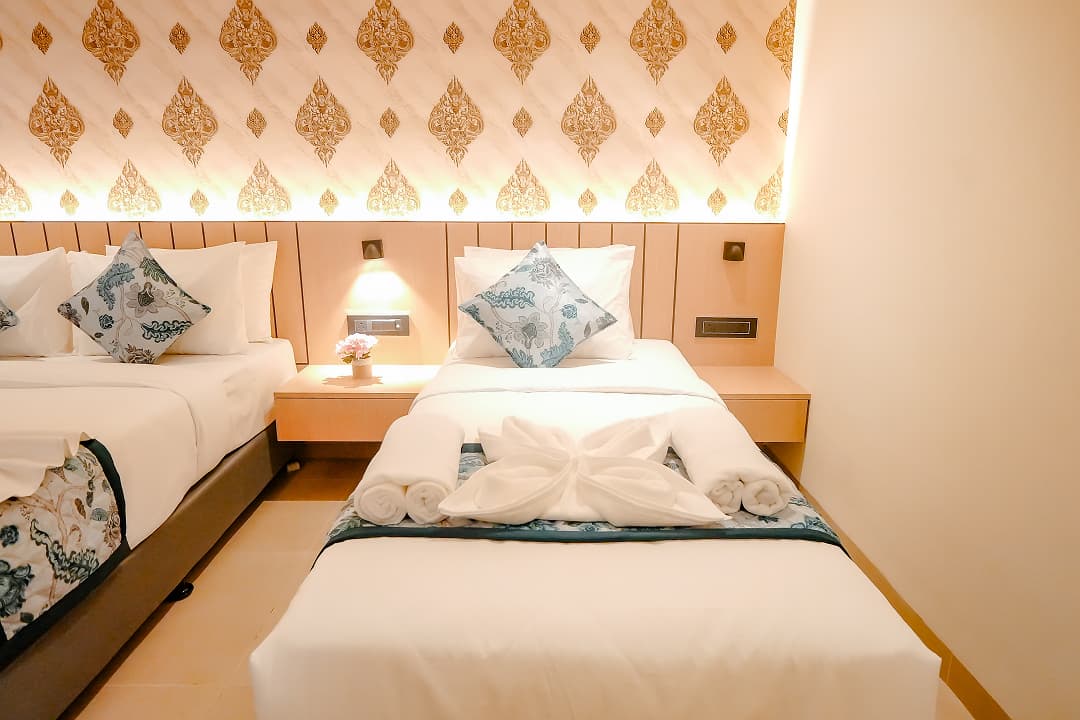 Bedroom single bed of Premium triple room at BKS Grand Hotel, Kodigehalli, Bengaluru