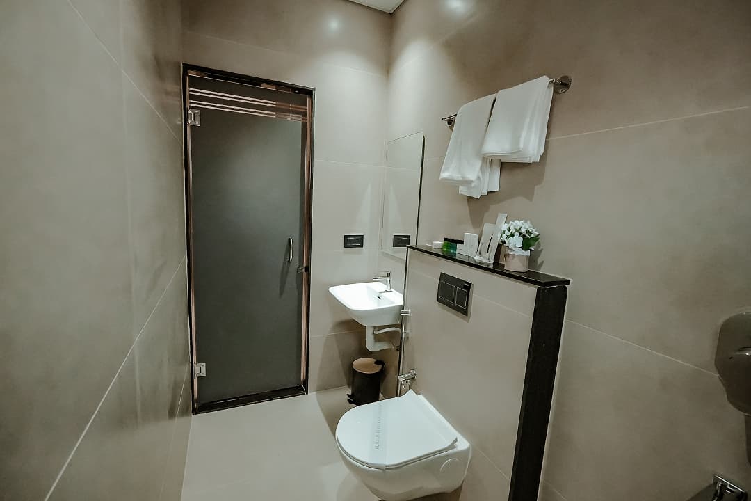 Bathroom backview of Standard double room at BKS Grand Hotel, Kodigehalli, Bengaluru