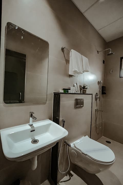 Bathroom frontview of Standard double room at BKS Grand Hotel, Kodigehalli, Bengaluru